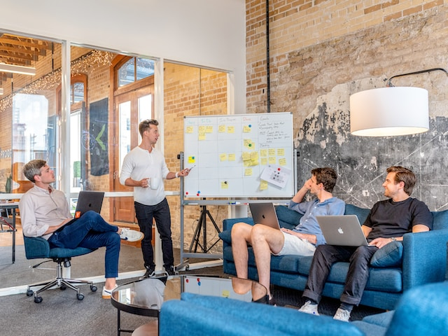 People discussing virtual event promotion strategy