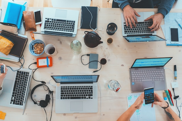 People discussing virtual event platforms in a meeting